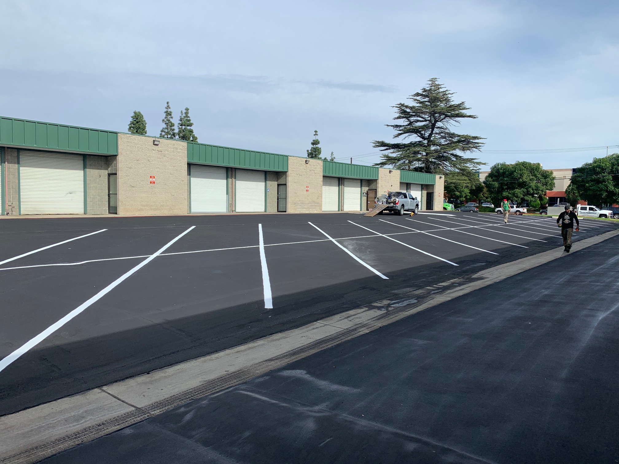 ADA compliant striping and parking lot pavement marking for a commercial business in Southern California.